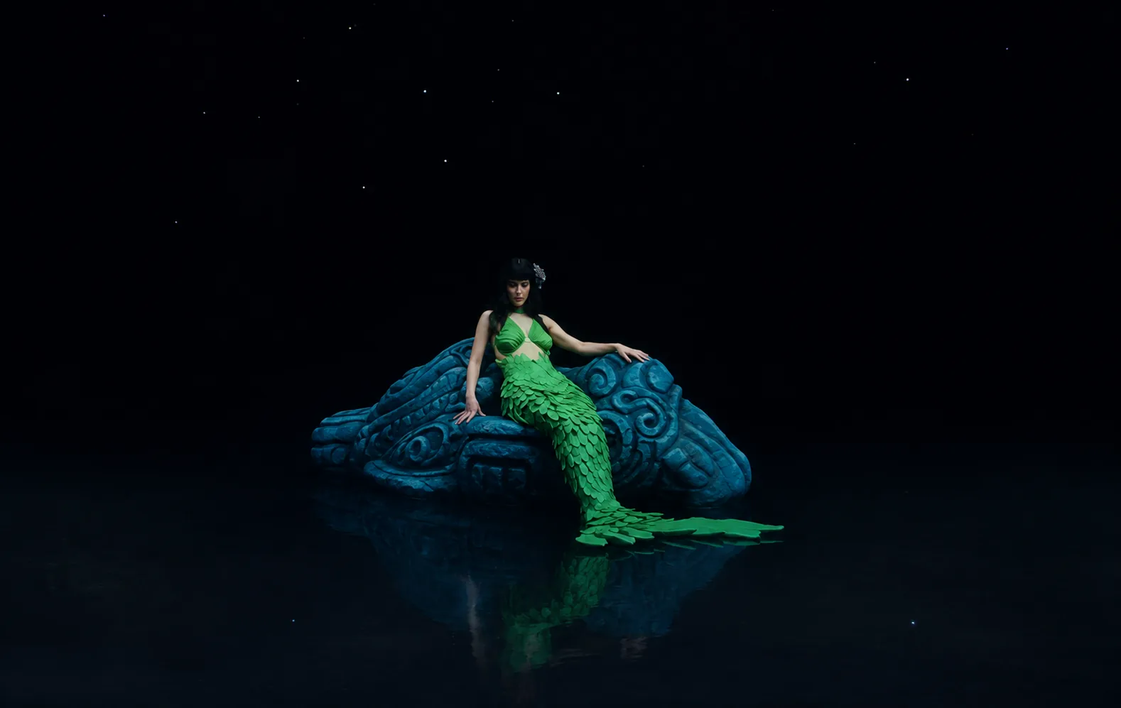 SUERTE — La Sirena on the stone serpent, over black water