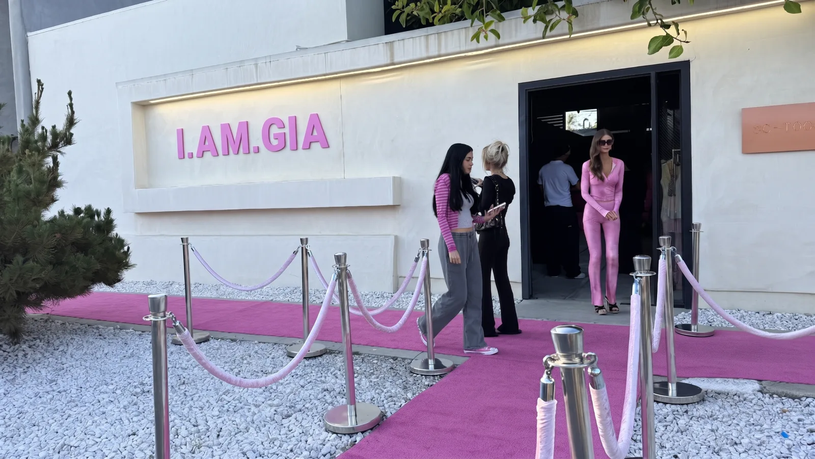 I.AM.GIA — The Complex LA façade with the I.AM.GIA sign and the pink carpet