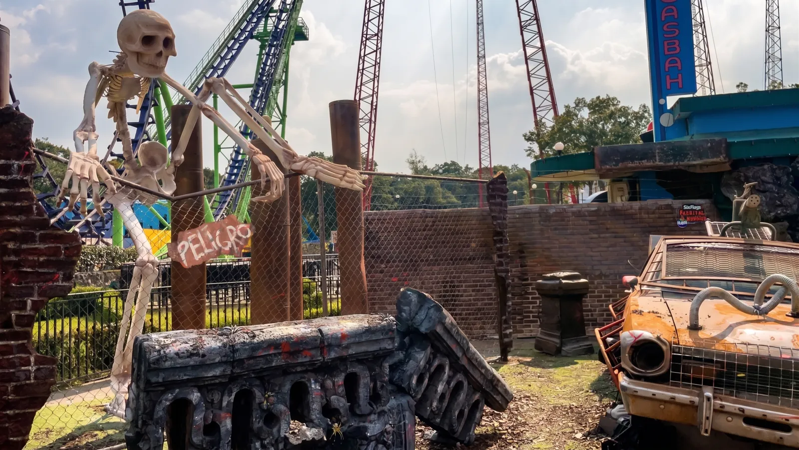 SIX FLAGS — Set 1 · The skeleton on the scaffold and the car against the coasters