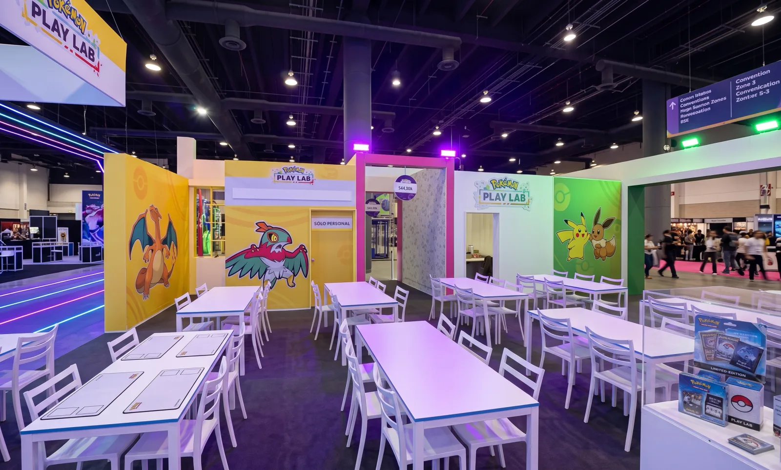 POKEMON PLAY LAB — The Play Lab tables under the purple light, the illustrated walls around