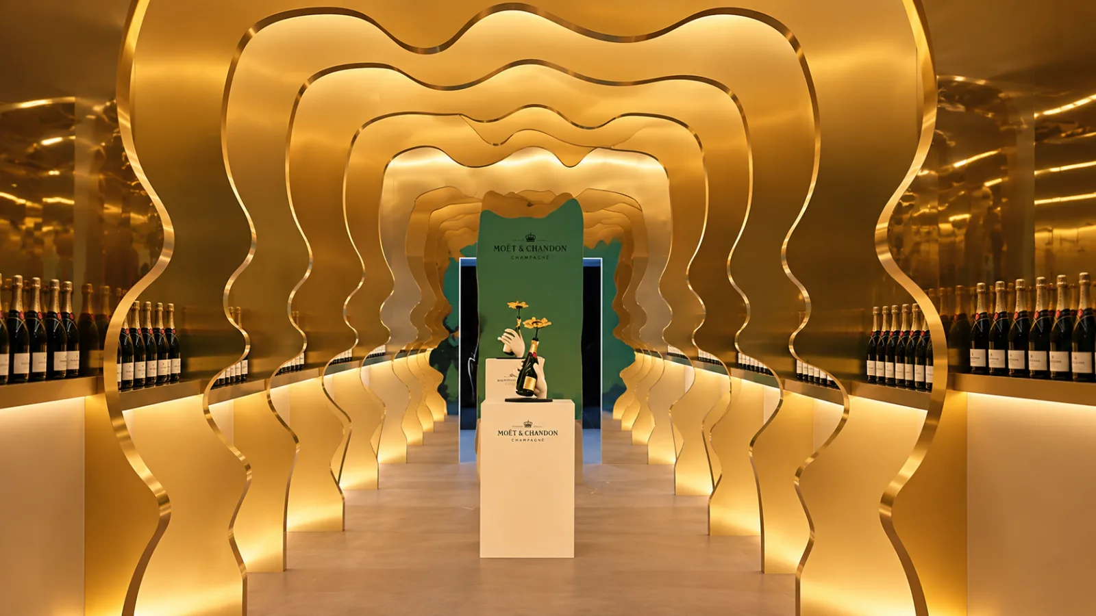 MOËT — The tunnel head-on: gilded waves all the way to the green wall