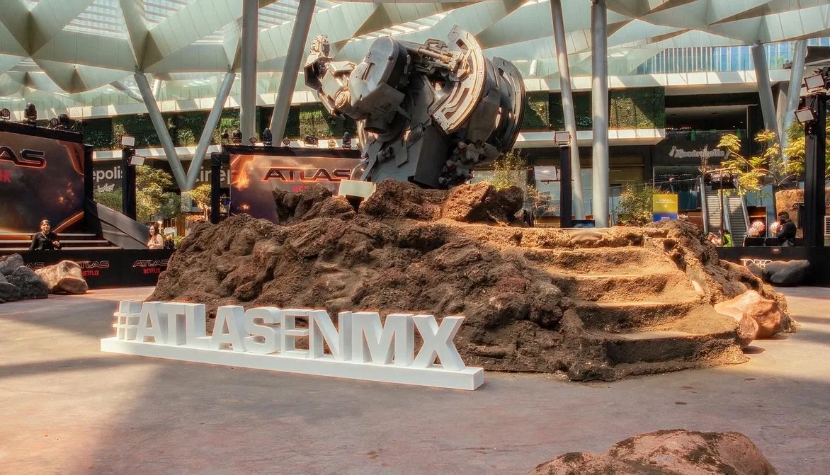 ATLAS — #ATLASENMX in white letters, the mech on the rock