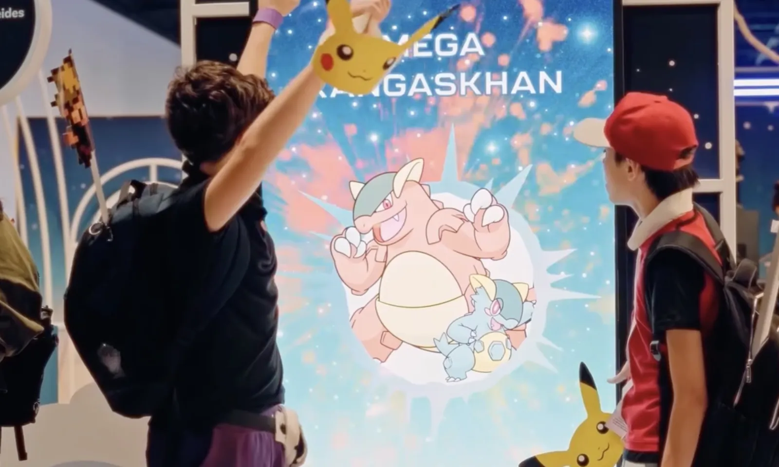 POKEMON — Mega Kangaskhan on screen: the kids with their Pikachu