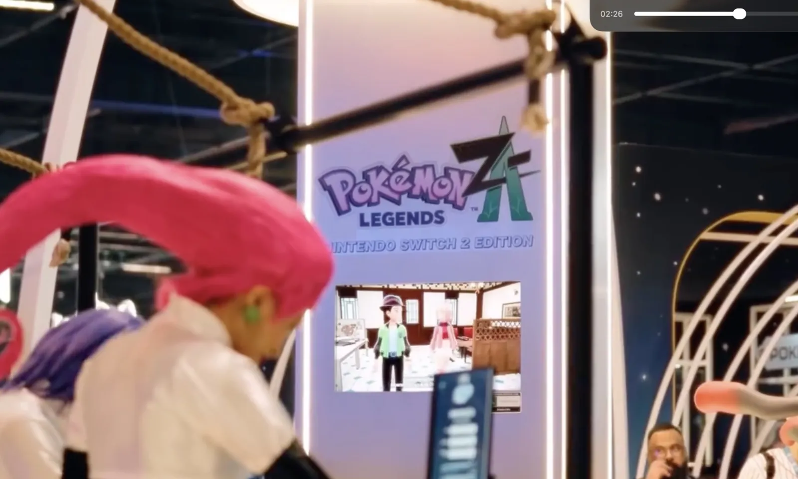 POKEMON — Pokémon Legends Z-A on the totem, a cosplayer passing by